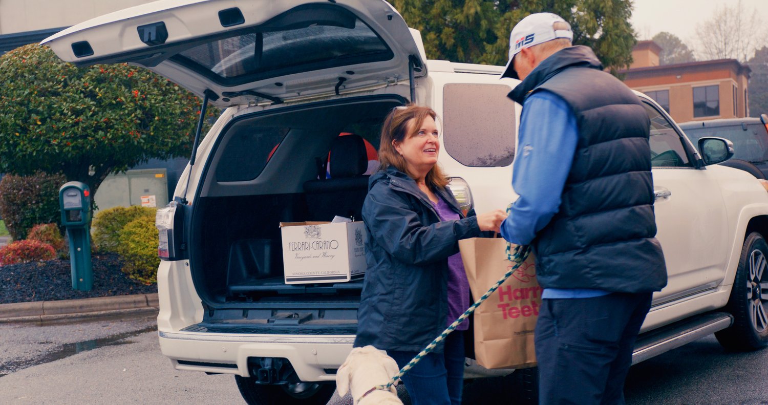 Woman smiling at Rcycle and Rescue event